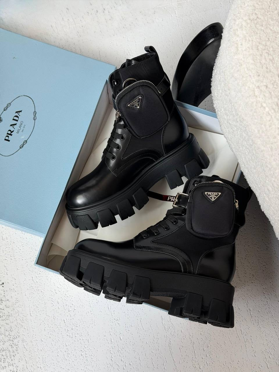 Prada Monolith Leather and Re-Nylon Combat Boots.