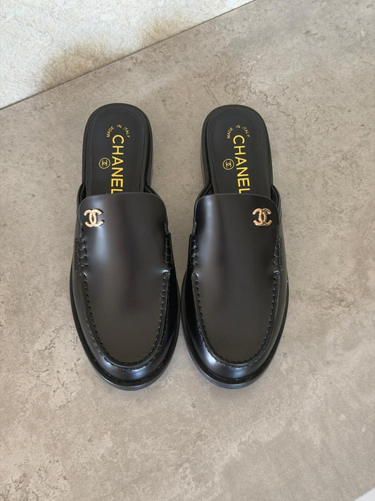 Chanel Mules in Black leather