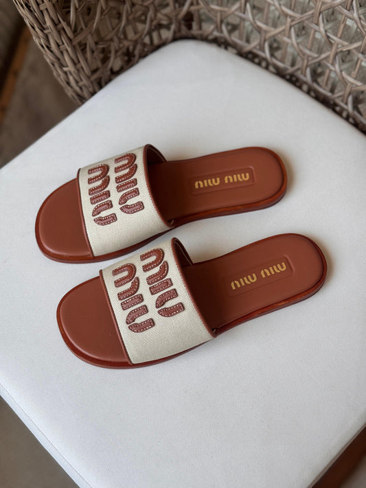 Miu Miu Canvas and leather slide sandals