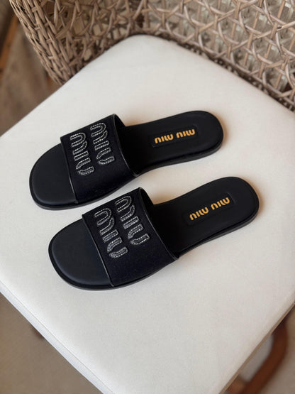 Miu Miu Canvas and leather slide sandals