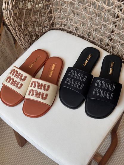 Miu Miu Canvas and leather slide sandals